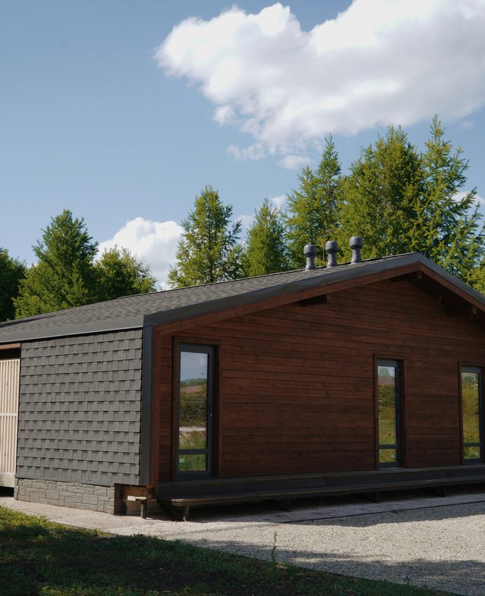 Completed A277 factory-built home — permanently installed in a natural setting