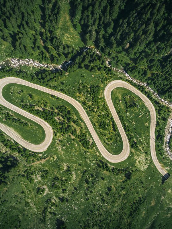 Winding remote road — representing the delays and complications of remote construction